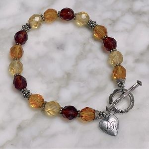 Sterling silver bracelet with multifaceted beads and toggle clasp